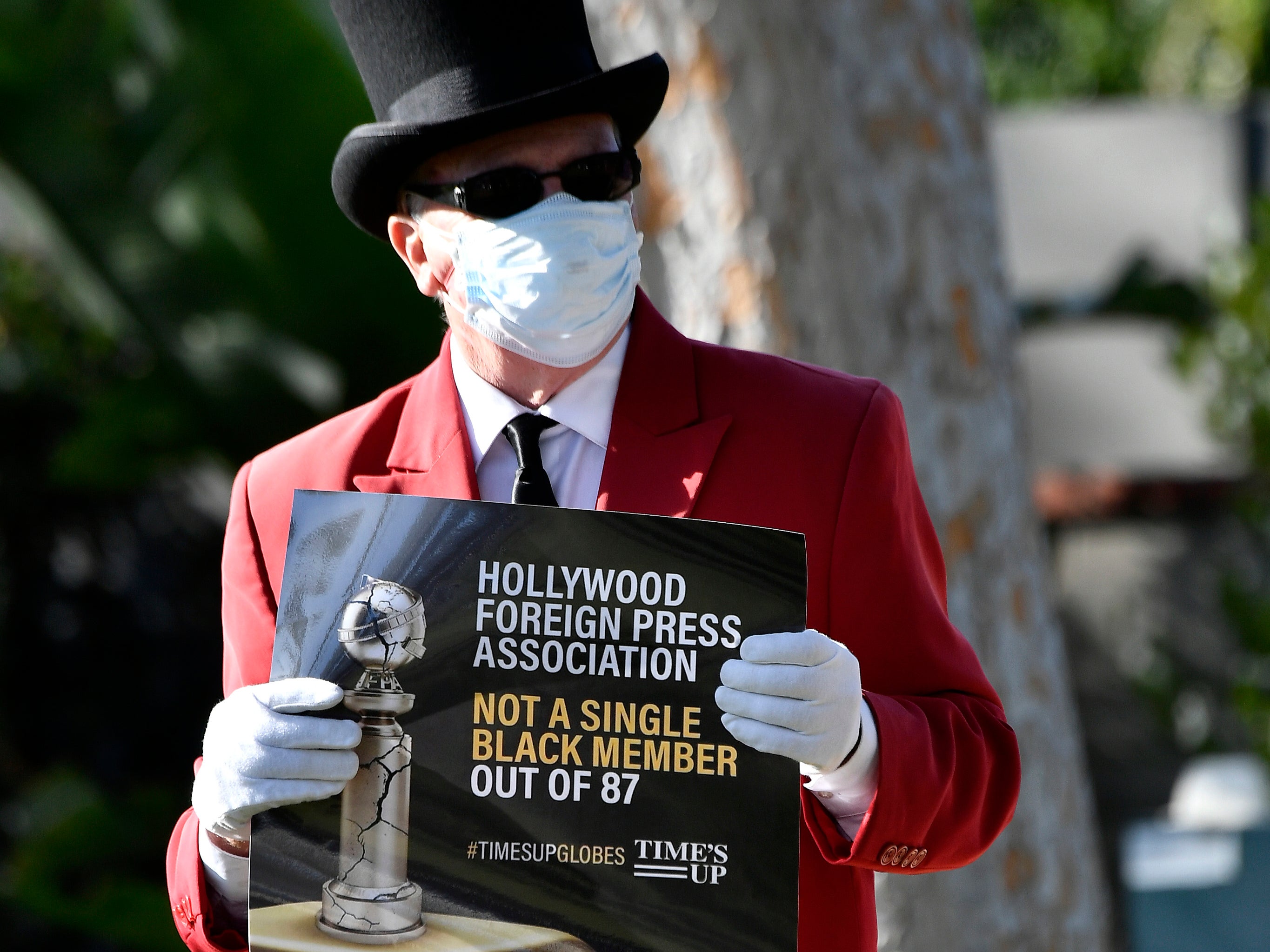 A protester outside the Beverly Hilton on 28 February 2021