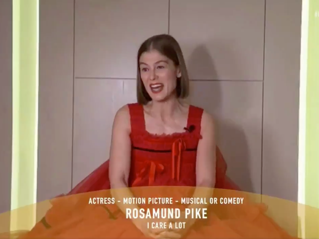 Rosamund Pike collects her Best Actress award at the Golden Globes