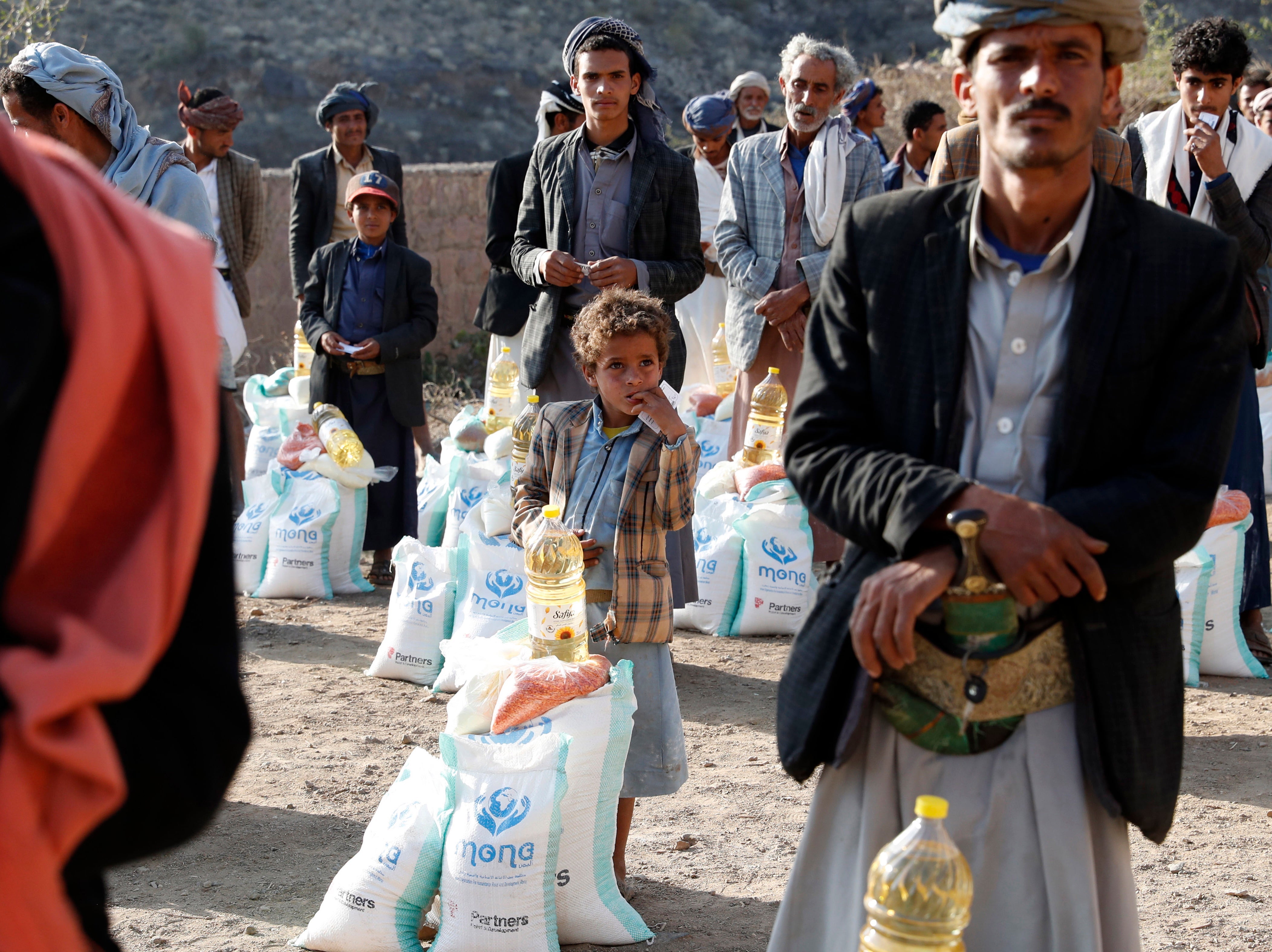 Yemenis at a food distribution centre in Bani al-Qallam, 100 km southwest of Sanaa