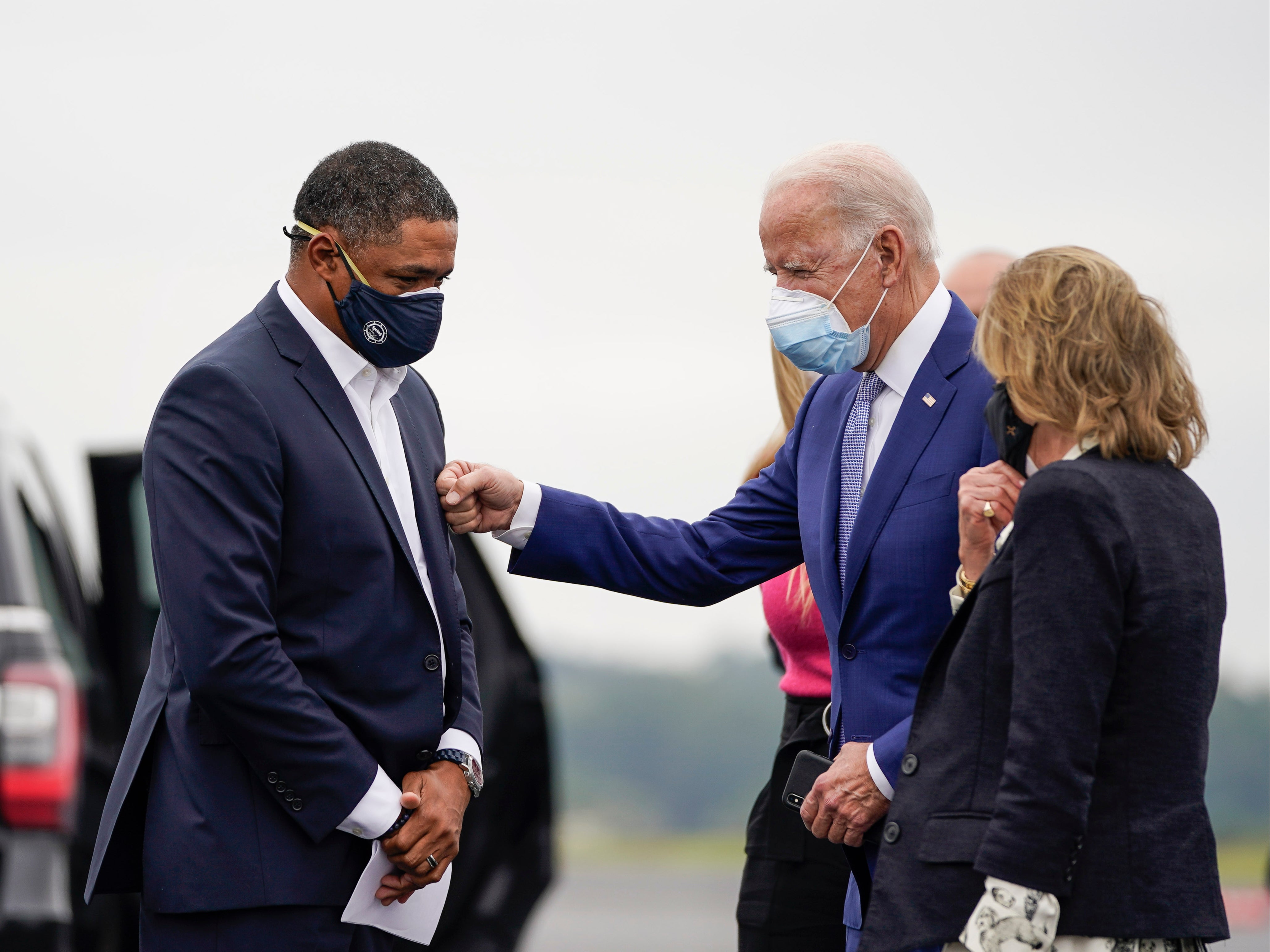 Former congressman Cedric Richmond (L) meets with President Joe Biden. Richmond is now a senior adviser to the president as well as director of the White House Office of Public Engagement