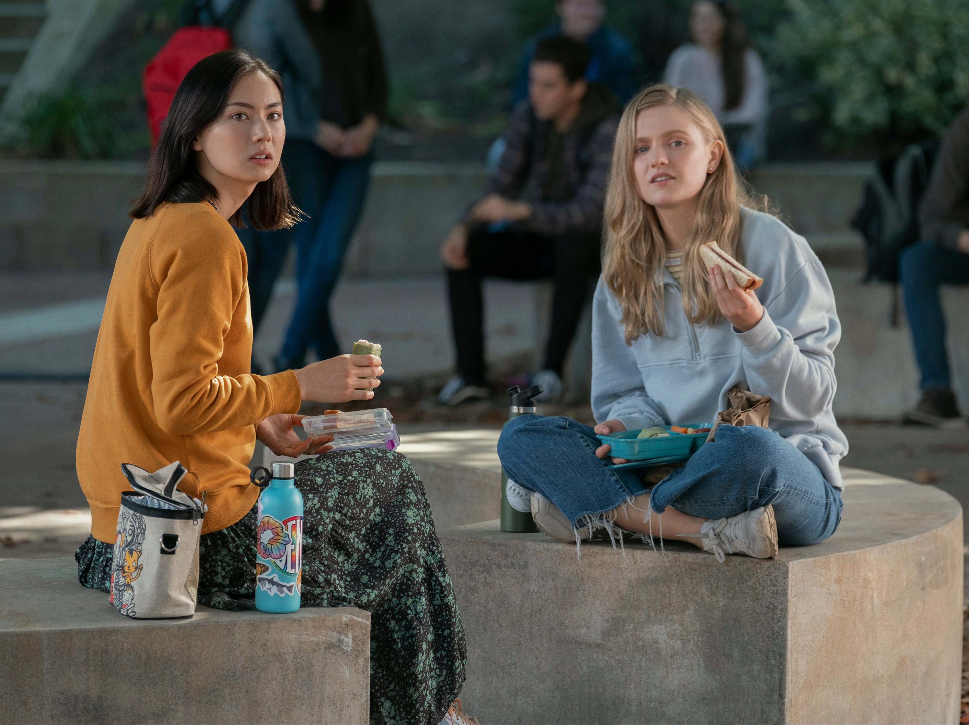 Vivian (Hadley Robinson) learns from her best friend Claudia (Lauren Tsai) that her ideas of rebellion are shaped by the relative privilege she’s afforded