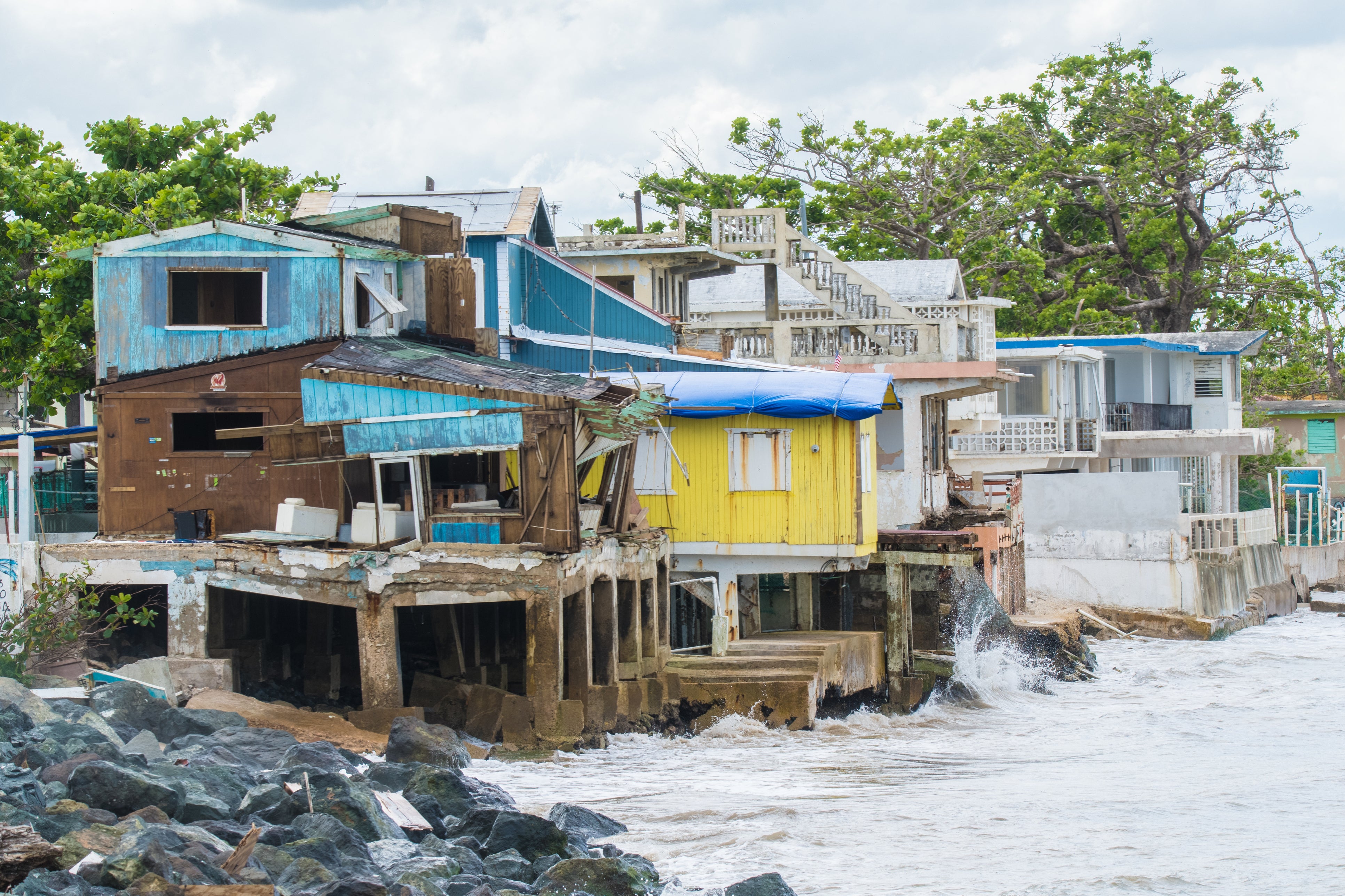 Seaside scene in Rincon, Puerto Rico after Hurricane Maria in 2017. Today a new report claims that the Trump administration delayed financial aid