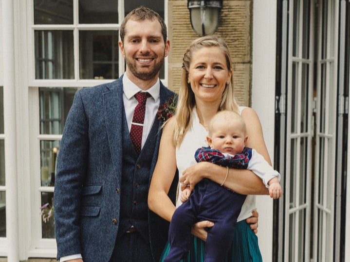 Laura Ellis and husband James, pictured with their baby son Josh who was born after the death of their first child, Theo, following mistakes at Frimley Park Hospital
