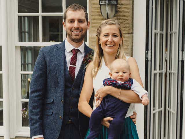 <p>Laura Ellis and husband James, pictured with their baby son Josh  who was born after the death of their first child, Theo, following mistakes at Frimley Park Hospital</p>