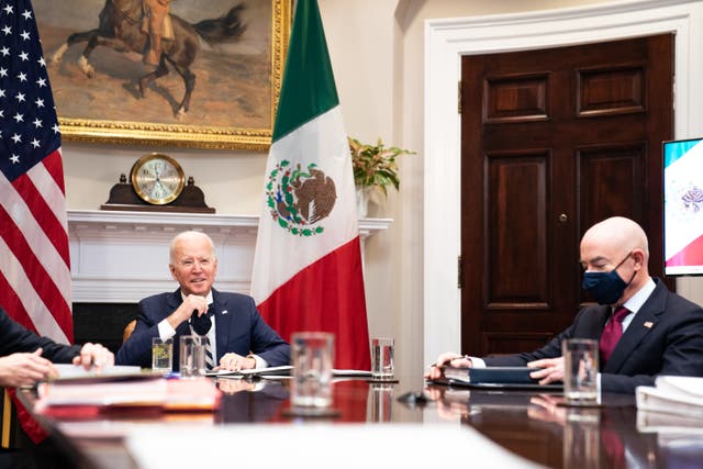 Joe Biden, left, and Homeland Security Secretary Alejandro Mayorkas attending a virtual meeting with their Mexican counterparts on Monday.