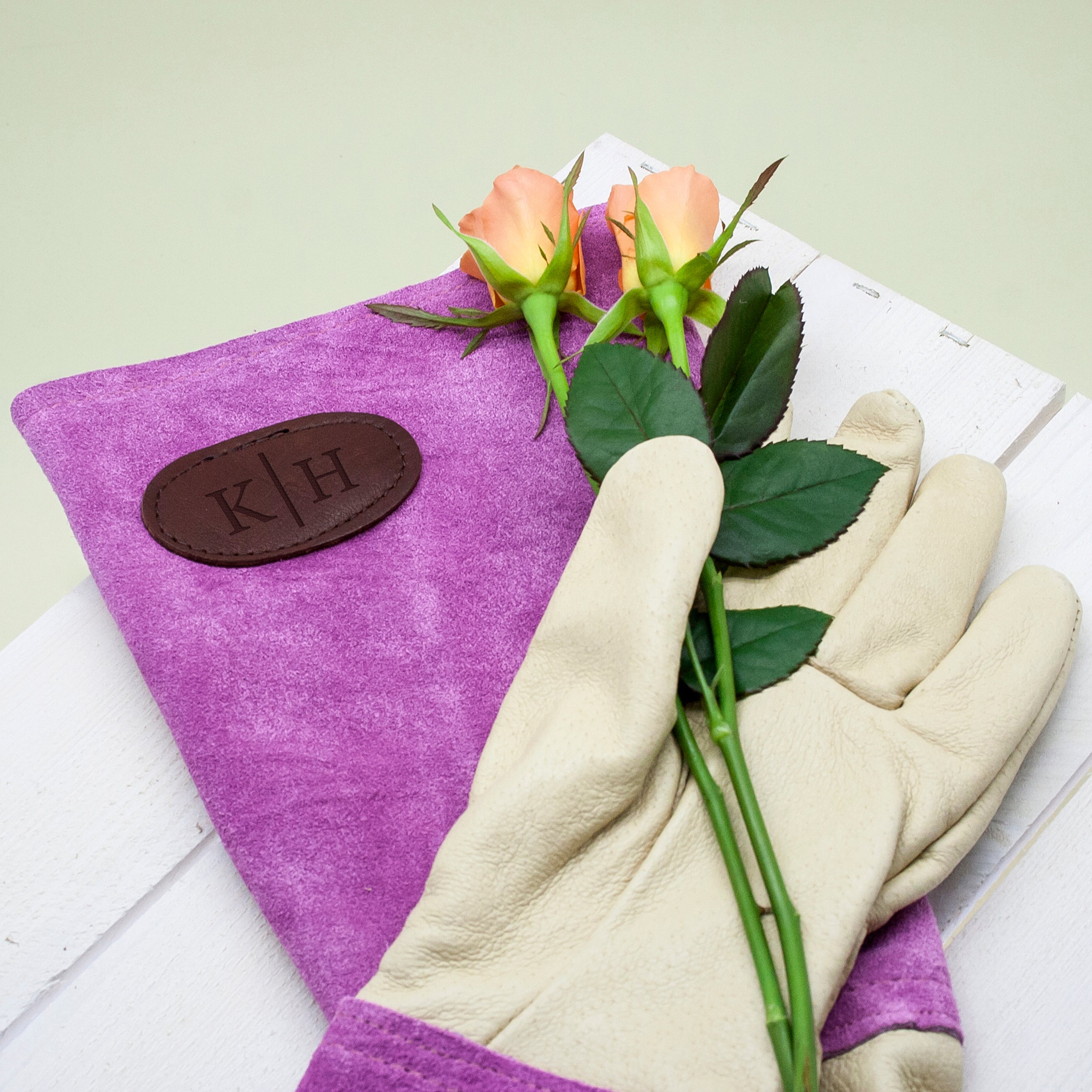 Pink leather and suede gardening gloves (Dobbies Garden Centres/PA)