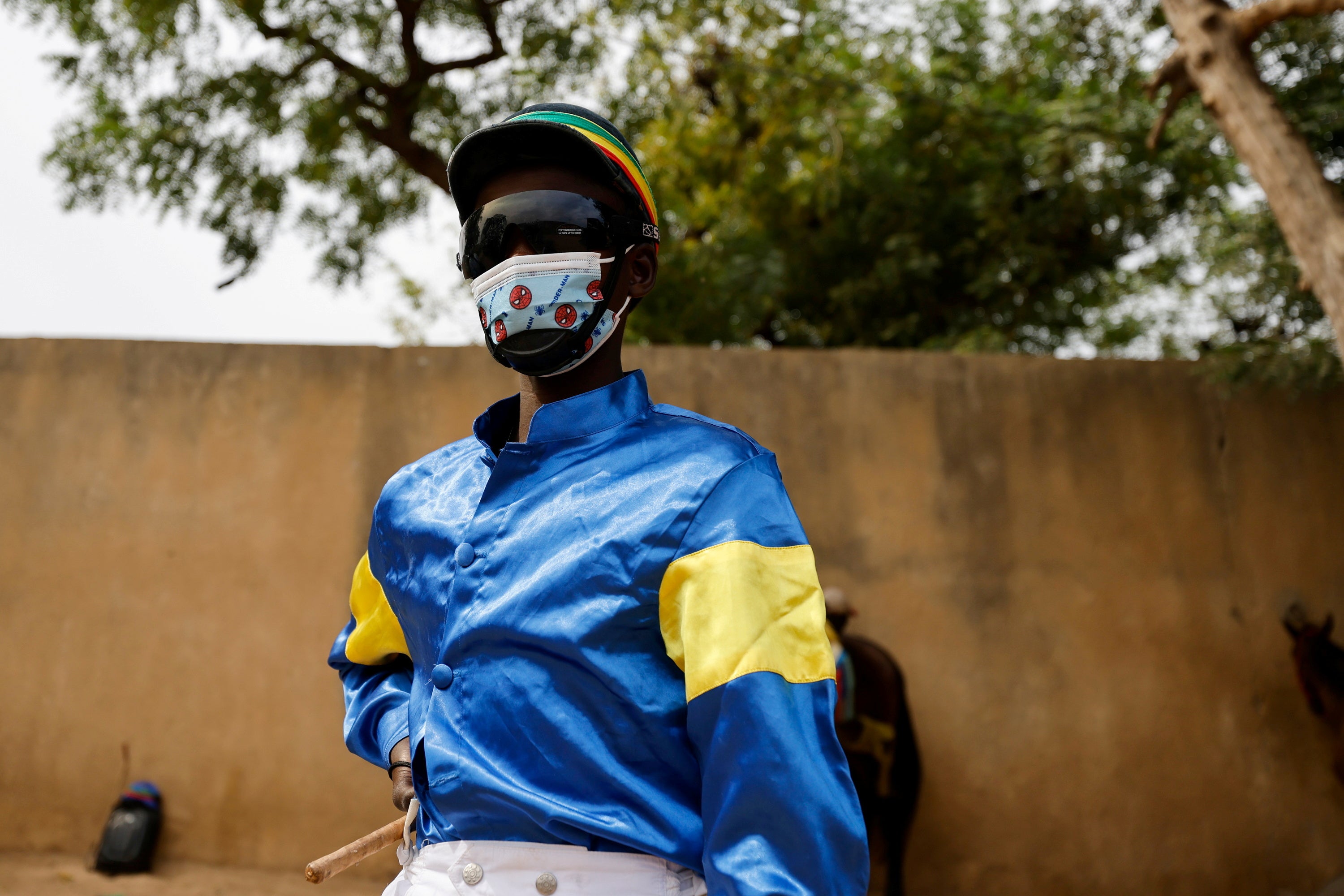 Diop before the race and wearing a mask