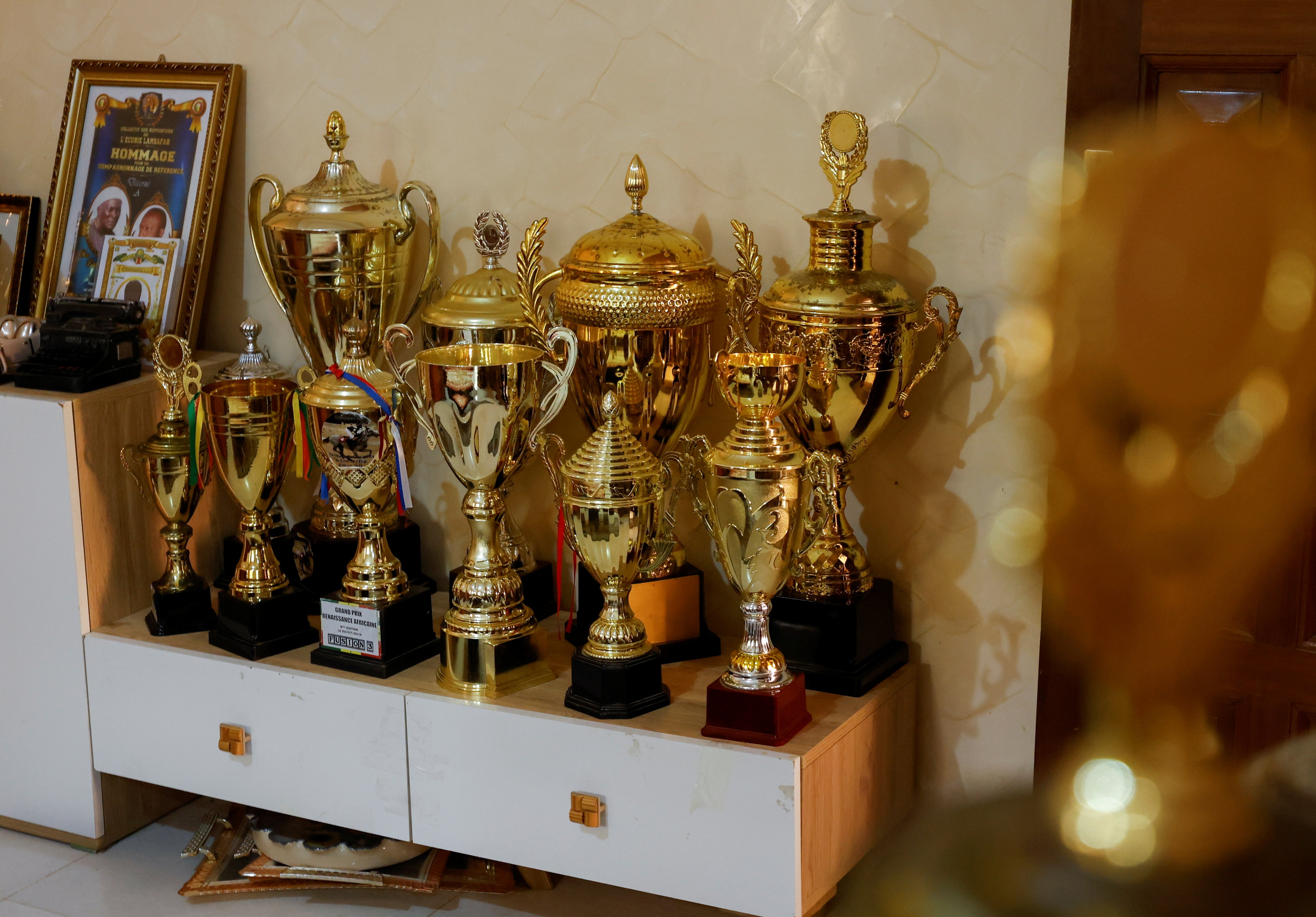 Trophies awarded to Diop are displayed at his coach Bao’s home