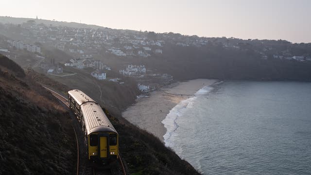 A train rounds the coast and heads towards the Carbis Bay Estate hotel and beach, which is set to be the main venue for the upcoming G7 summit