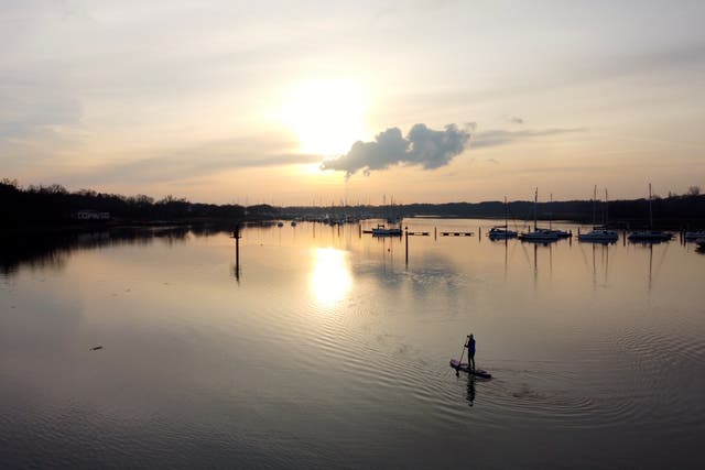 <p> Paddleboarding into the sunset</p>