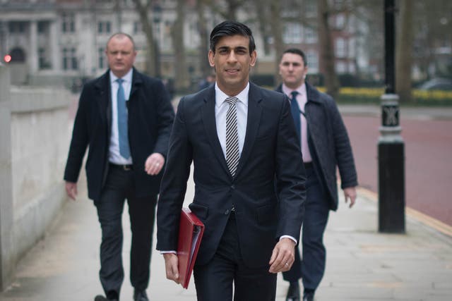Chancellor of the Exchequer, Rishi Sunak, walks from the Treasury to No 11 Downing Street, London, the day before delivering his budget