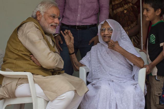 <p>File: Indian prime minister Narendra Modi seen with his mother Heeraben Modi after seeking her blessing on 16 May, 2014 in Ahmedabad, India after winning the general election</p>