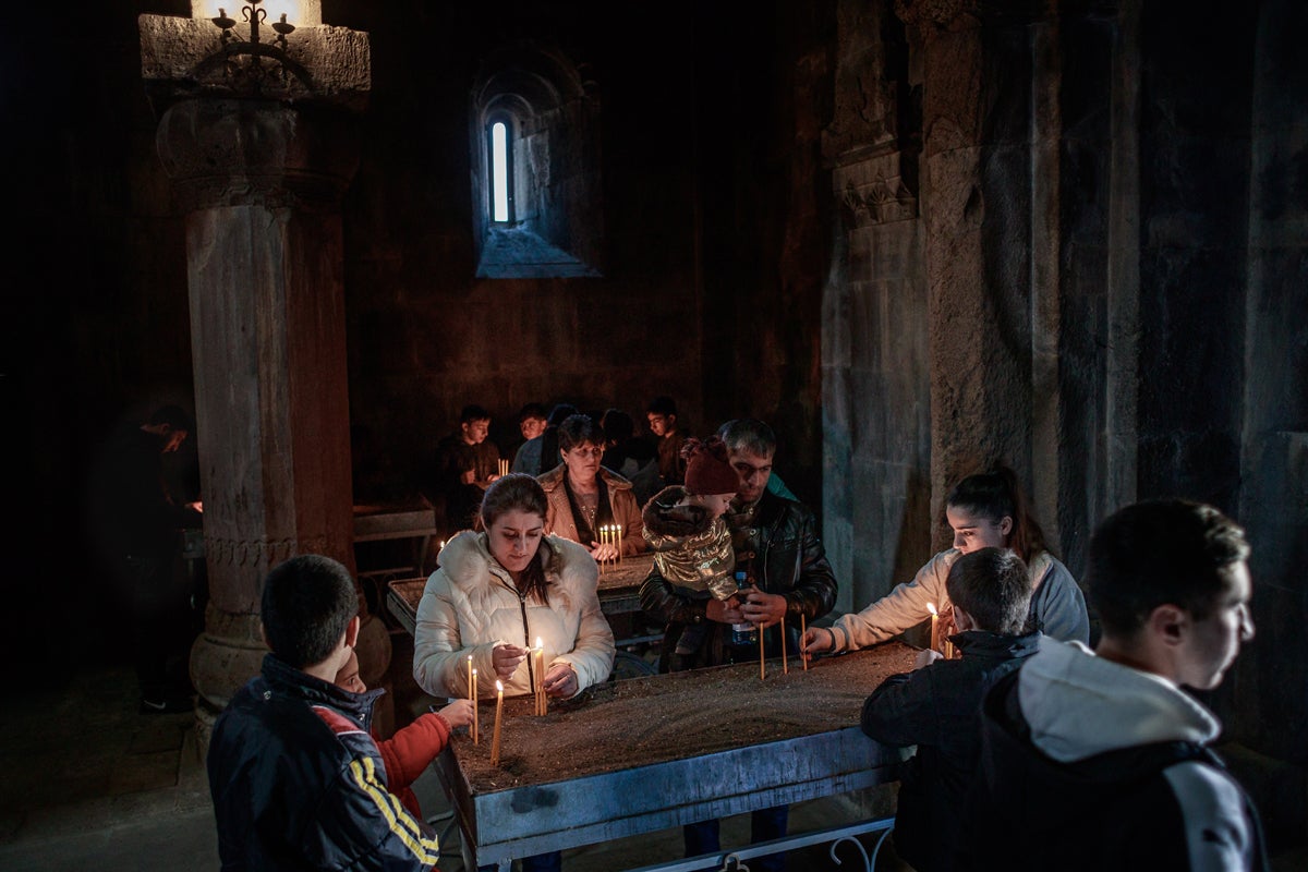 People light candles during a Sunday Mass at the Gandzasar monastery in Martakert province. Nagorno-Karabakh has dozens of monasteries and churches built in the 10th century. Some of the temples are now under control of Azerbaijani authorities