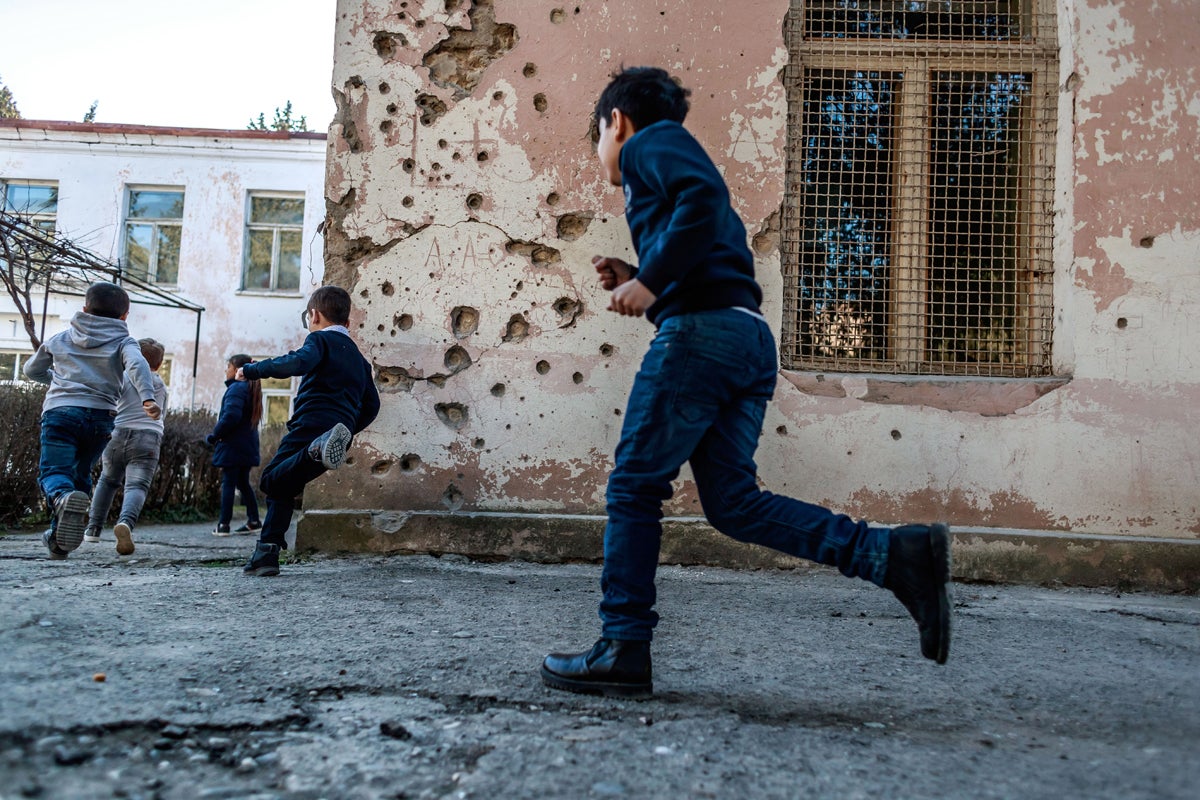 Children play in Martuni in the self-proclaimed Nagorno-Karabakh Republic. The Monte Melkonian school has already repaired its roof and director Narine Kevorkian has been welcoming its students