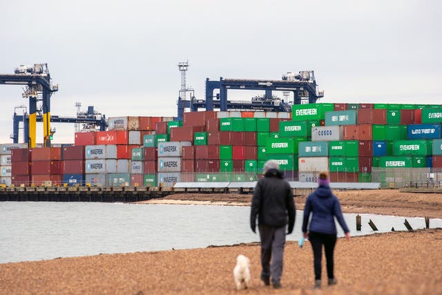 <p>Shipping containers are unloaded from a cargo ship at the Port of Felixstowe in Suffolk</p>