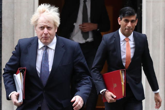 The prime minister, Boris Johnson, left, and the chancellor, Rishi Sunak, leave 10 Downing Street