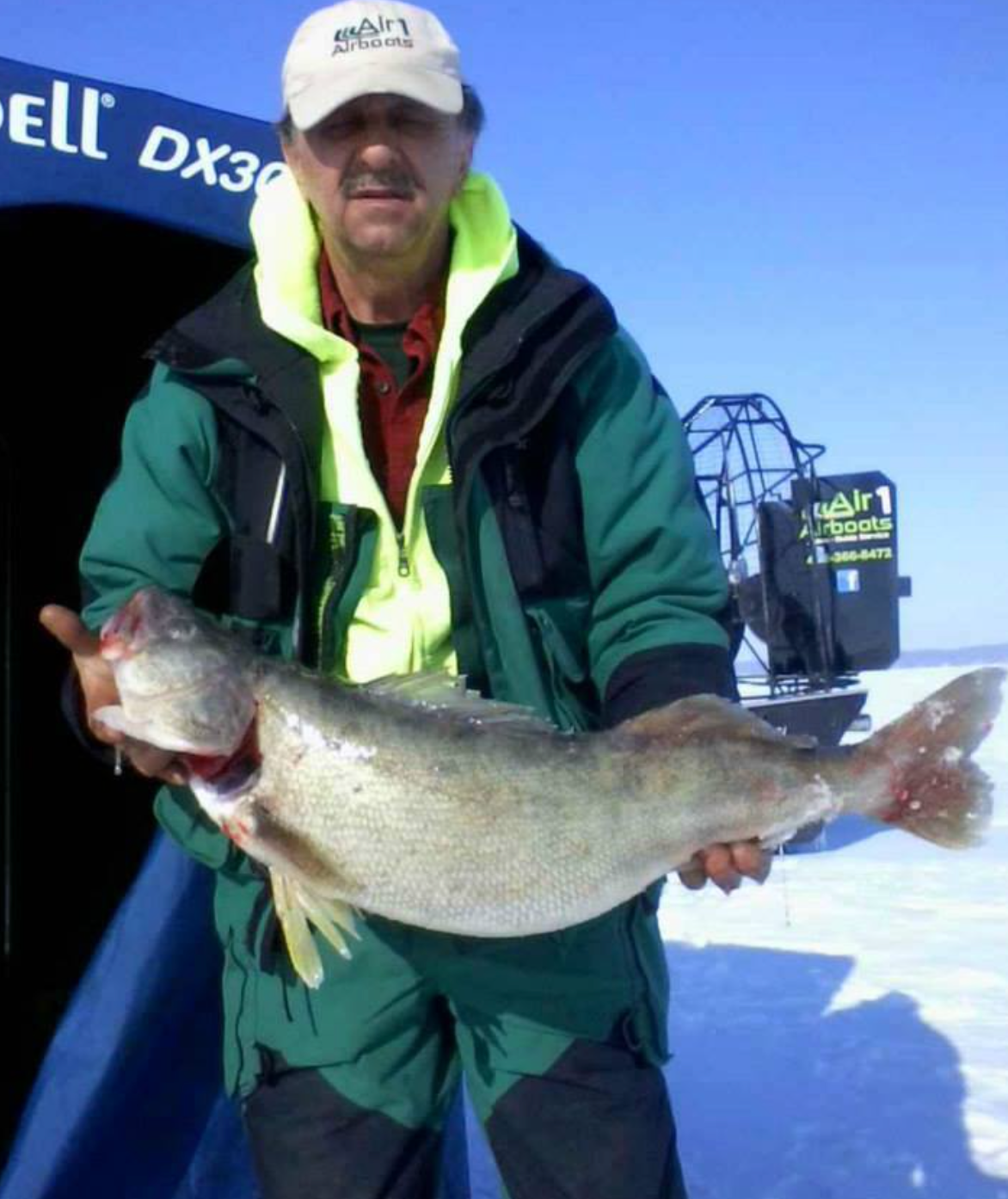 Captain Tony Muscioni with a walleye, caught during an ice fishing expedition on Lake Erie