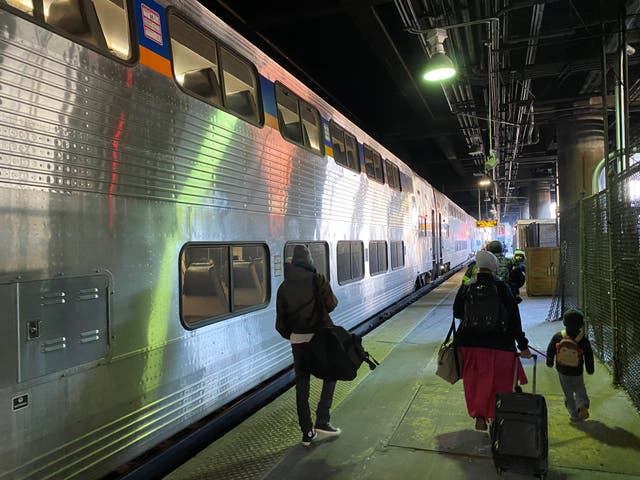 <p>A train waits on the platform in Washington DC. A little way up the platform, the Amtrak Capitol Limited waits to begin a 17-hour journey to Chicago. </p>