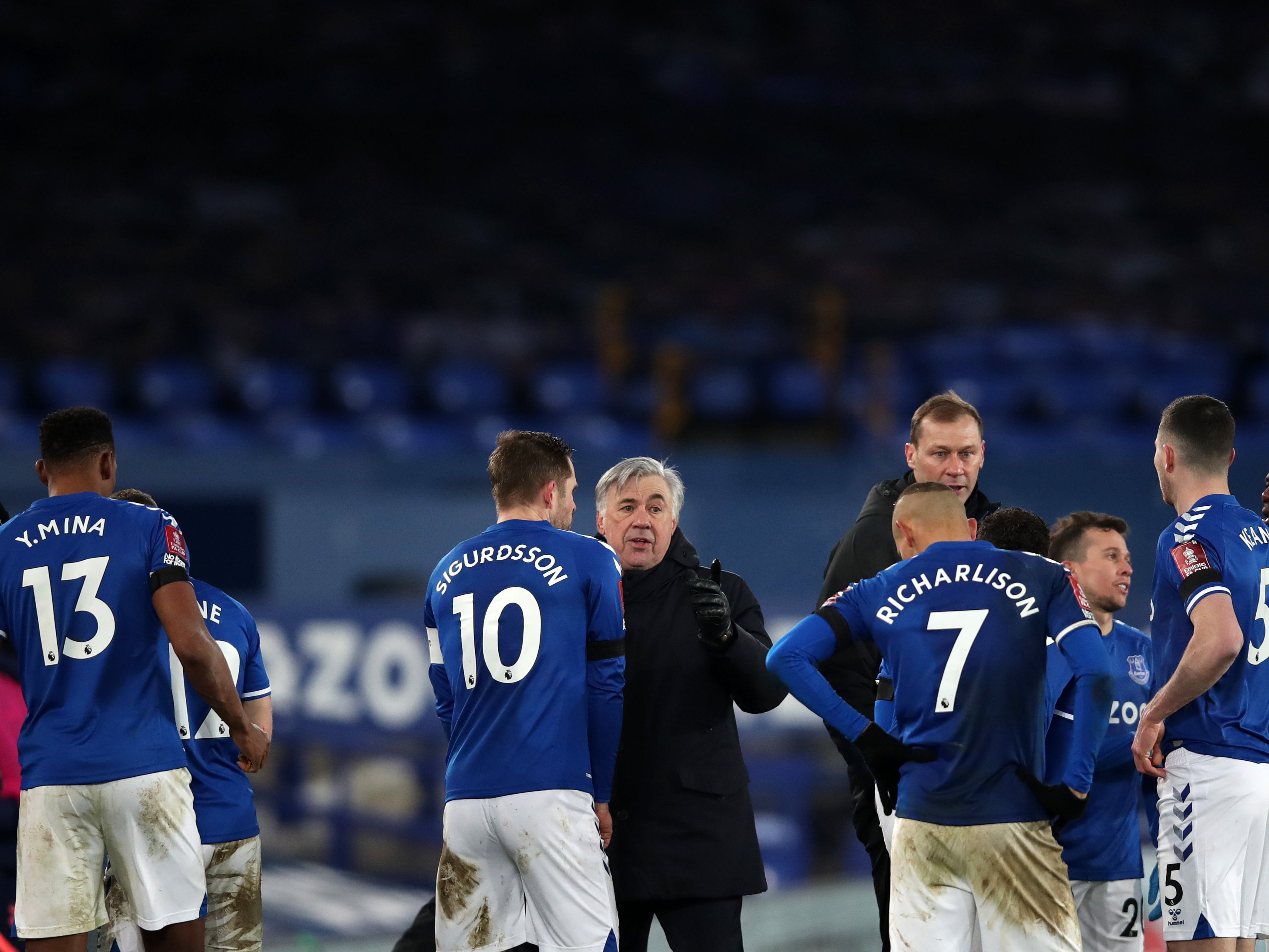 Everton coach Carlo Ancelotti with his players