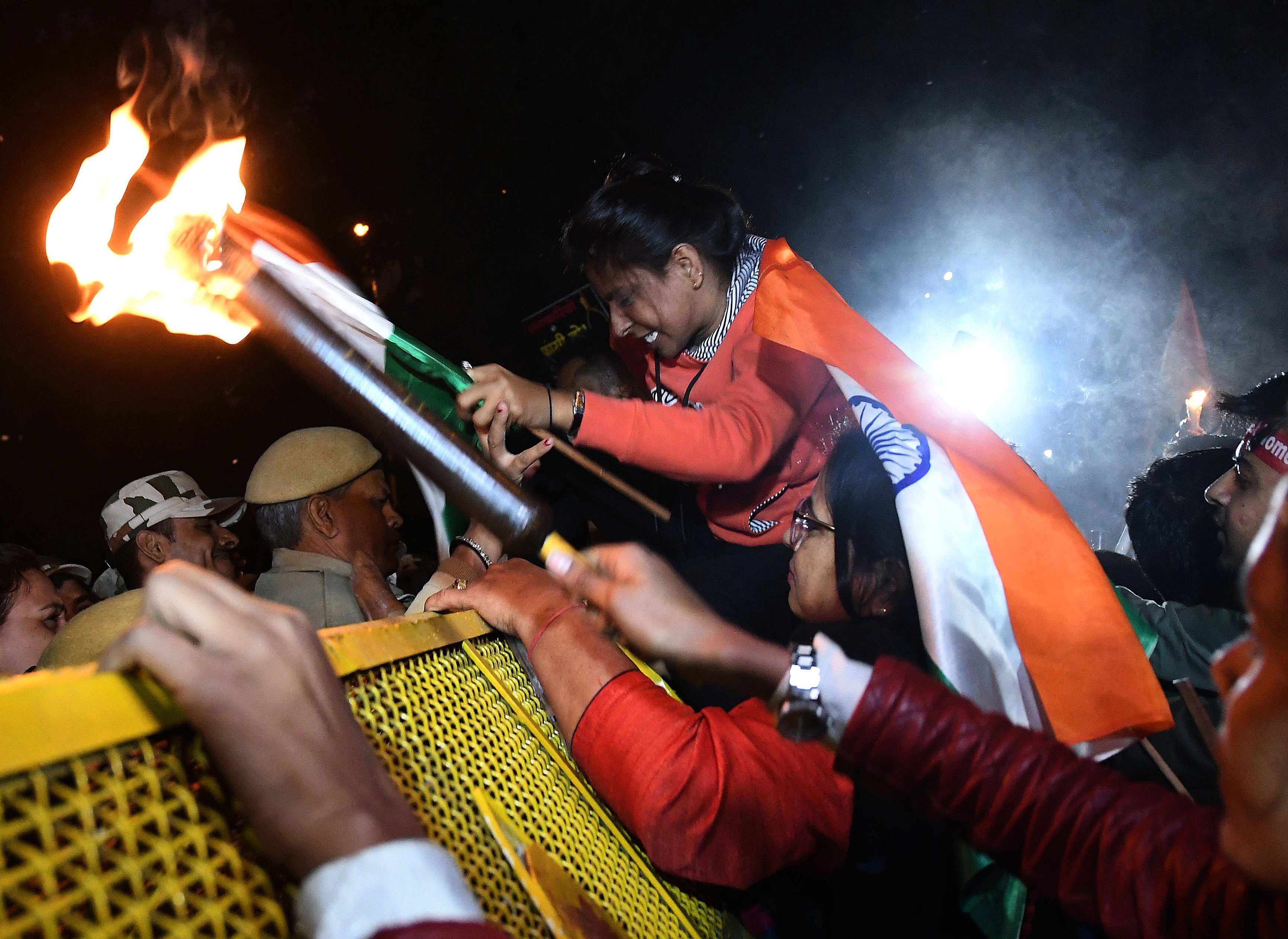File image: Indian women rights activists try to break Police barricades during a candle light march in December 2019 in New Delhi to denounce violence against women