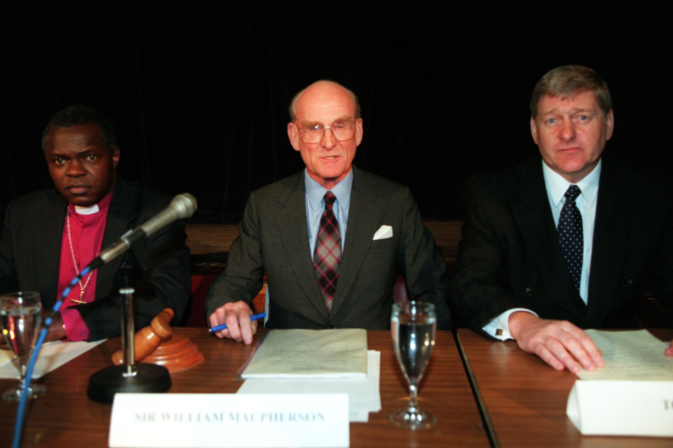 Macpherson (centre) at a preliminary hearing for the inquiry