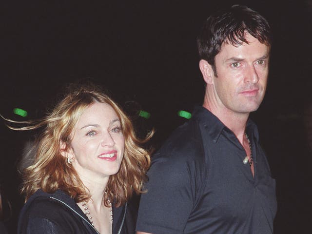 <p>Rupert Everett with some sweaty barmaid (allegedly) at an event in 1999</p>