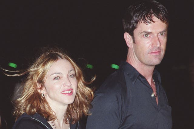 <p>Rupert Everett with some sweaty barmaid (allegedly) at an event in 1999</p>