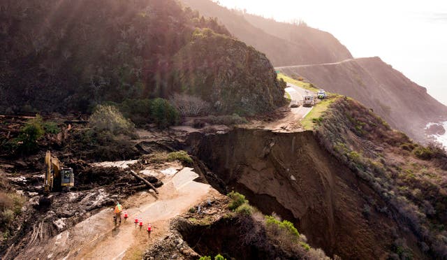 <p>Construction crews work on a section of Highway 1, which collapsed into the Pacific Ocean near Big Sur, California on January 31, 2021. Heavy rains caused debris flows of trees, boulders and mud that washed out a 150-foot section of the road. </p>