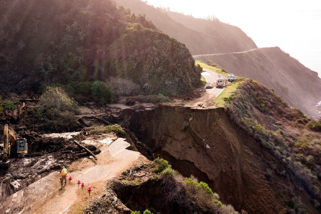 <p>Construction crews work on a section of Highway 1, which collapsed into the Pacific Ocean near Big Sur, California on January 31, 2021. Heavy rains caused debris flows of trees, boulders and mud that washed out a 150-foot section of the road. </p>