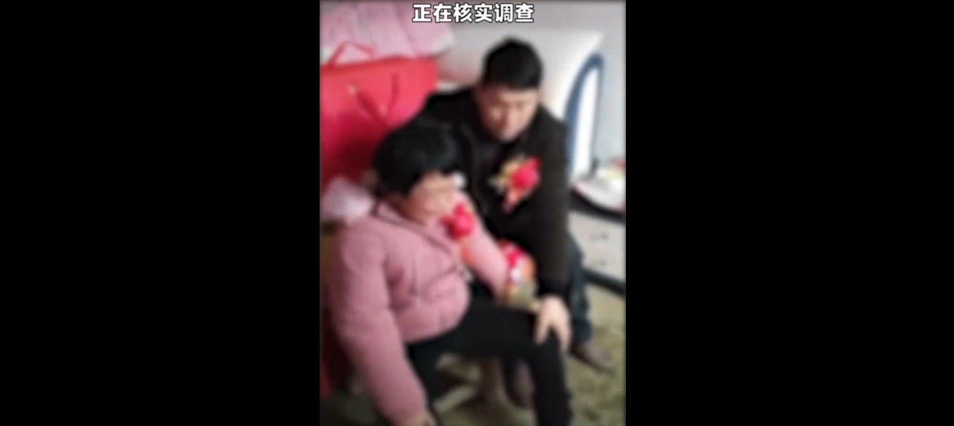 A Chinese man, 55, can be seen consoling a 20-year-old mentally unstable woman after reportedly marrying her