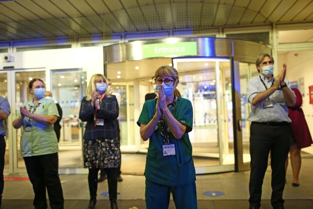 <p>NHS staff outside the Chelsea and Westminster Hospital in London</p>