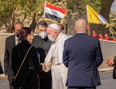 Pope Francis arrives in Iraq and calls for an end to divisions, amid huge security operation 