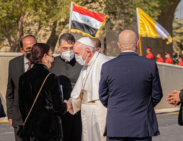 <p>The Pope is greeted at Baghdad airport on Friday at the start of his historic visit</p>