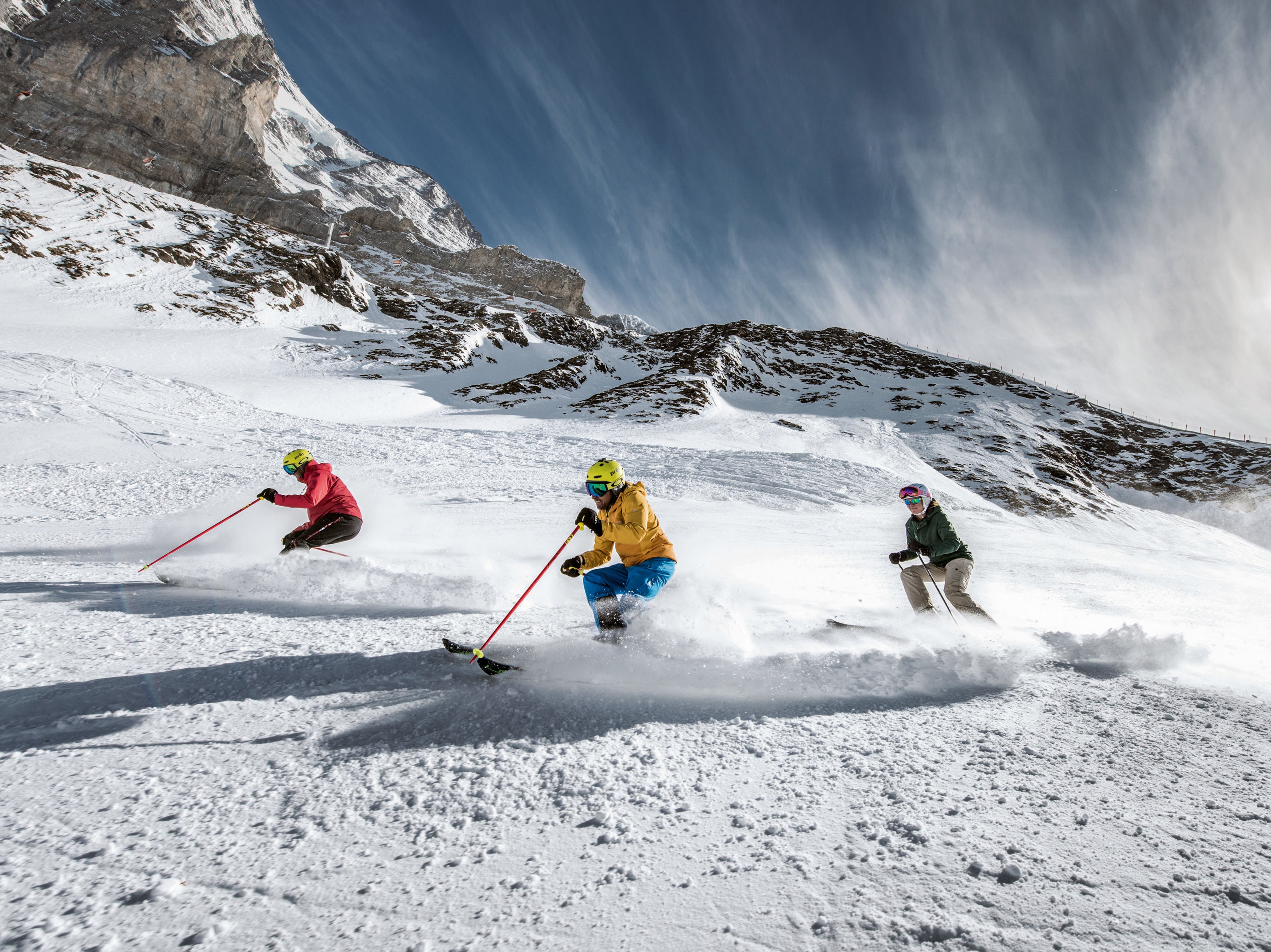 <p>Skiers in Jungfrau.  Resorts are going green to reduce their impact</p>