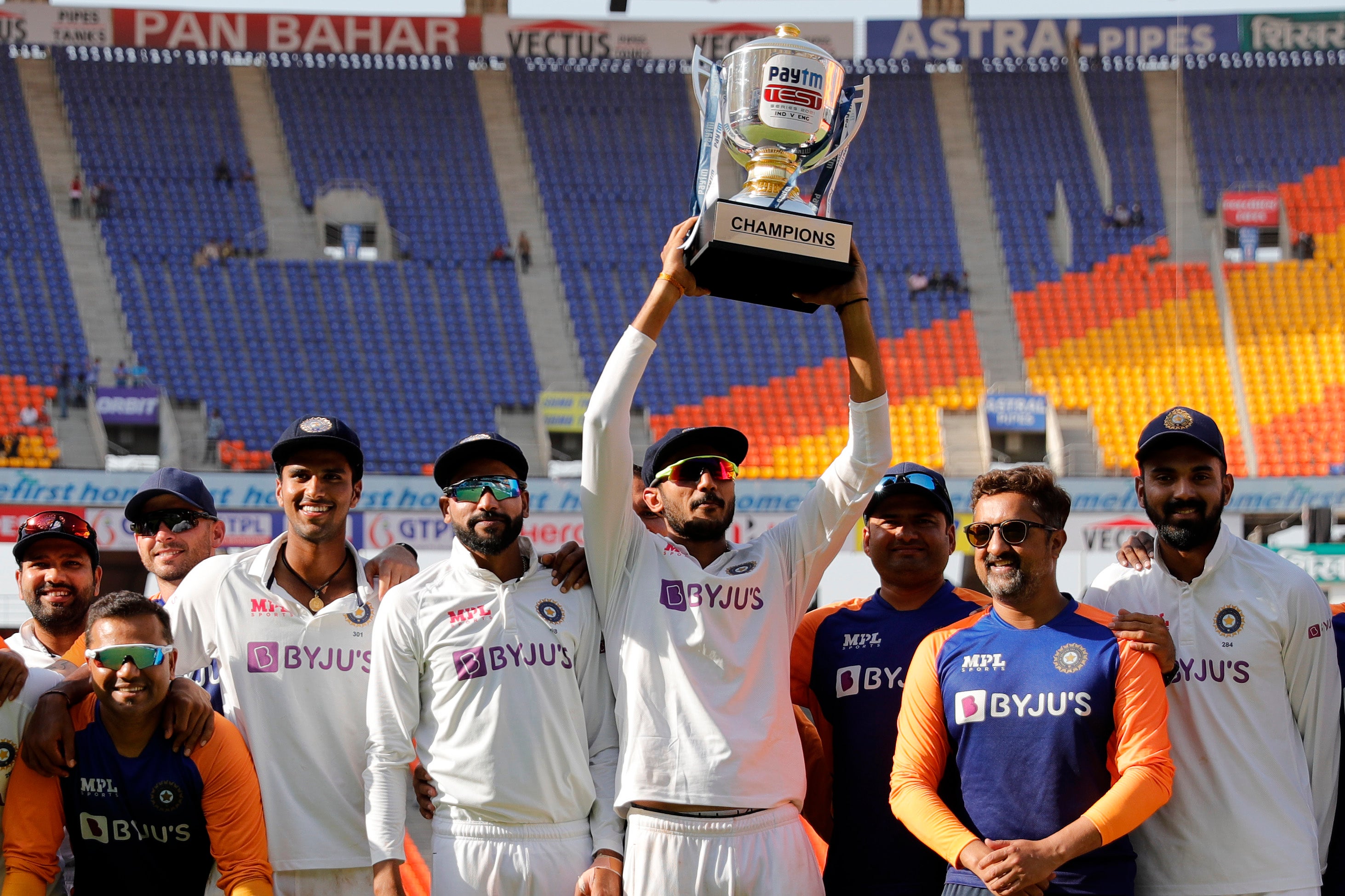 Axar Patel of India raising high the series trophy