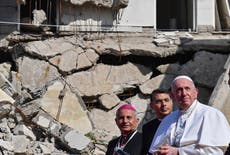 Pope prays for war victims during historic visit to former Isis stronghold of Mosul