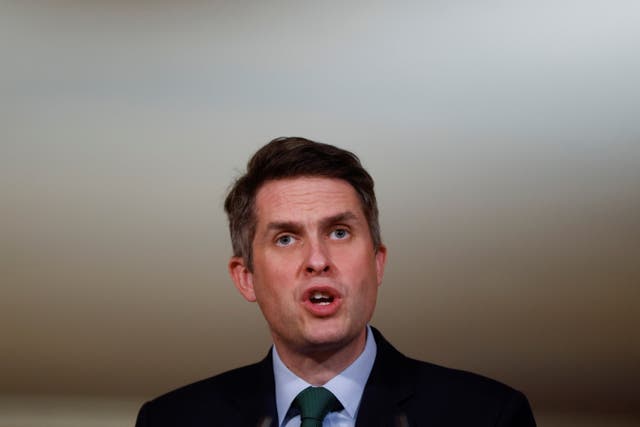 <p>Gavin Williamson says the government will ‘absolutely’ be keeping GCSEs</p>