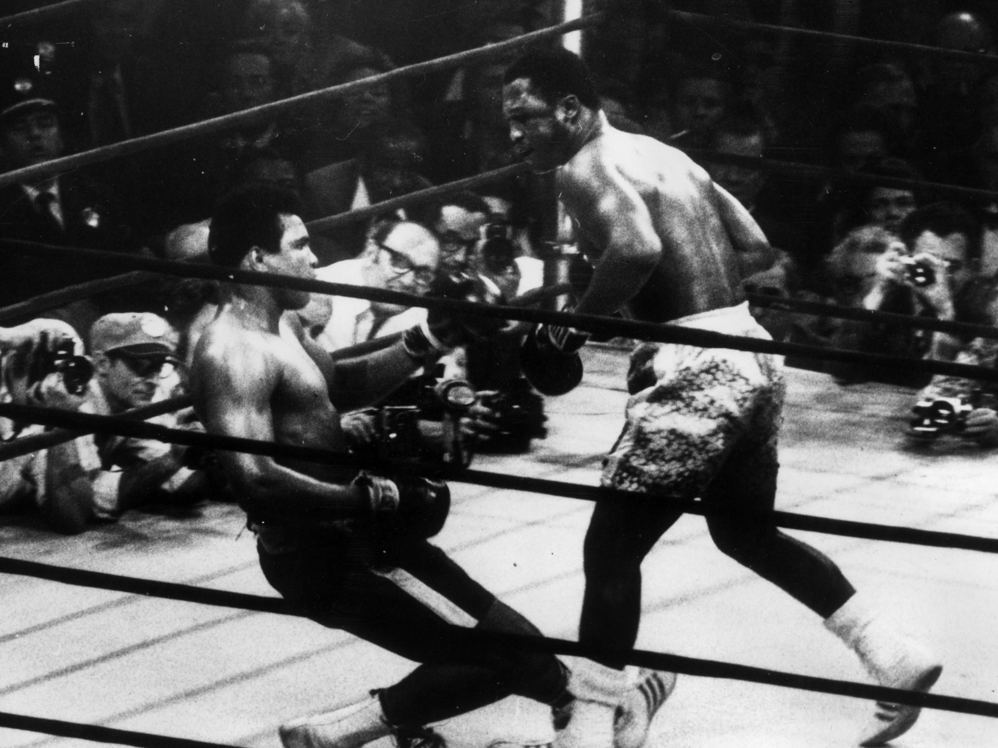 Joe Frazier knocks down Muhammad Ali in their meeting in March 1971