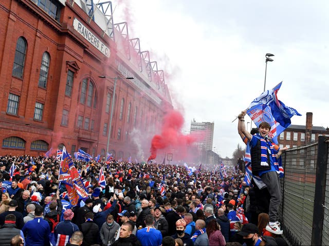 Rangers fans gather to celebrate at the club’s Ibrox Stadium
