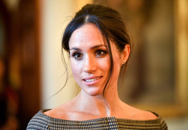 <p>Meghan Markle chats with people inside the Drawing Room during a visit to Cardiff Castle on January 18, 2018 in Cardiff, Wales.</p>