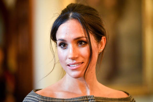 <p>Meghan Markle chats with people inside the Drawing Room during a visit to Cardiff Castle on January 18, 2018 in Cardiff, Wales.</p>