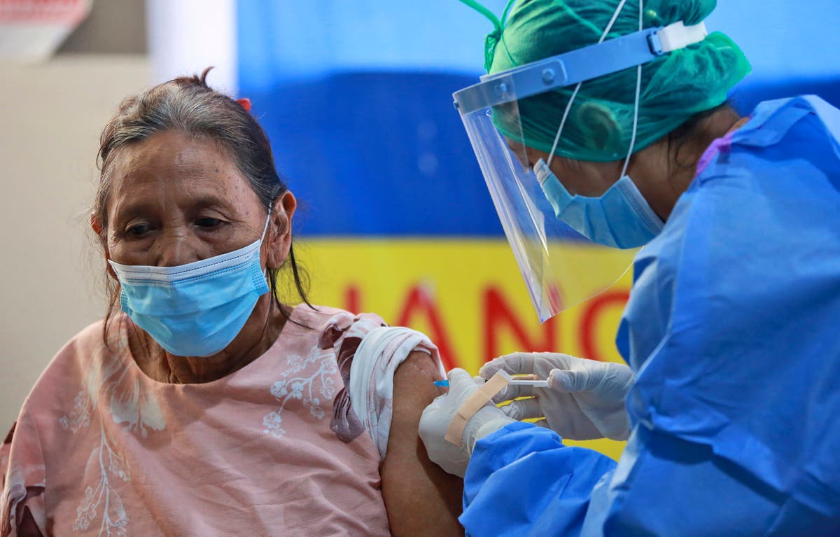 The Latest: New Zealand to use only Pfizer virus vaccine