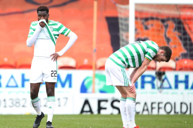 Celtic players react after drawing at Dundee United