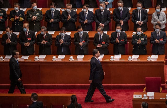 <p>Chinese president Xi Jinping and premier Li Keqiang are applauded as they arrive at the second plenary session of the National People's Congress in Beijing, China</p>