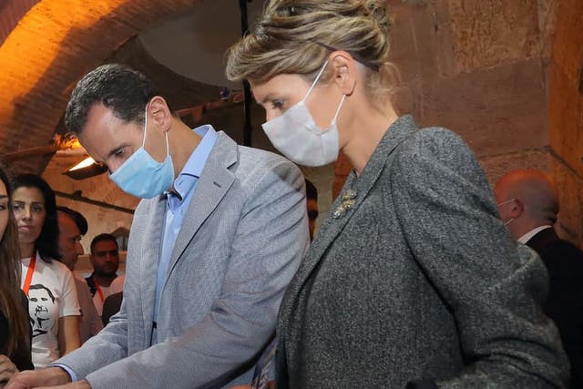 Syrian President Bashar al-Assad and his wife Asma wearing face masks during the pandemic in November