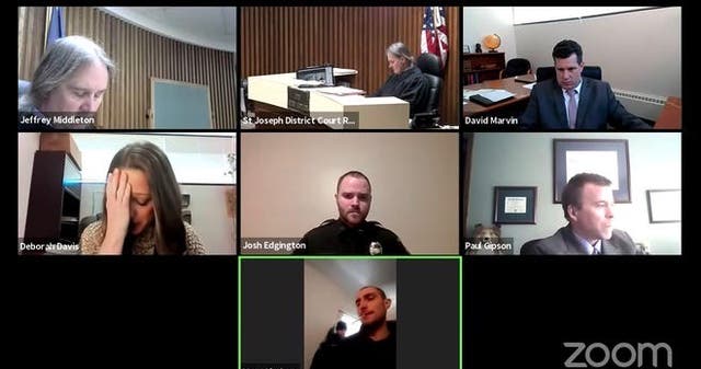 A screenshot showing defendant Coby Harris (pictured below) being arrested in the Zoom screen of his alleged victim during a virtual court hearing in Michigan that was live-streamed on YouTube.