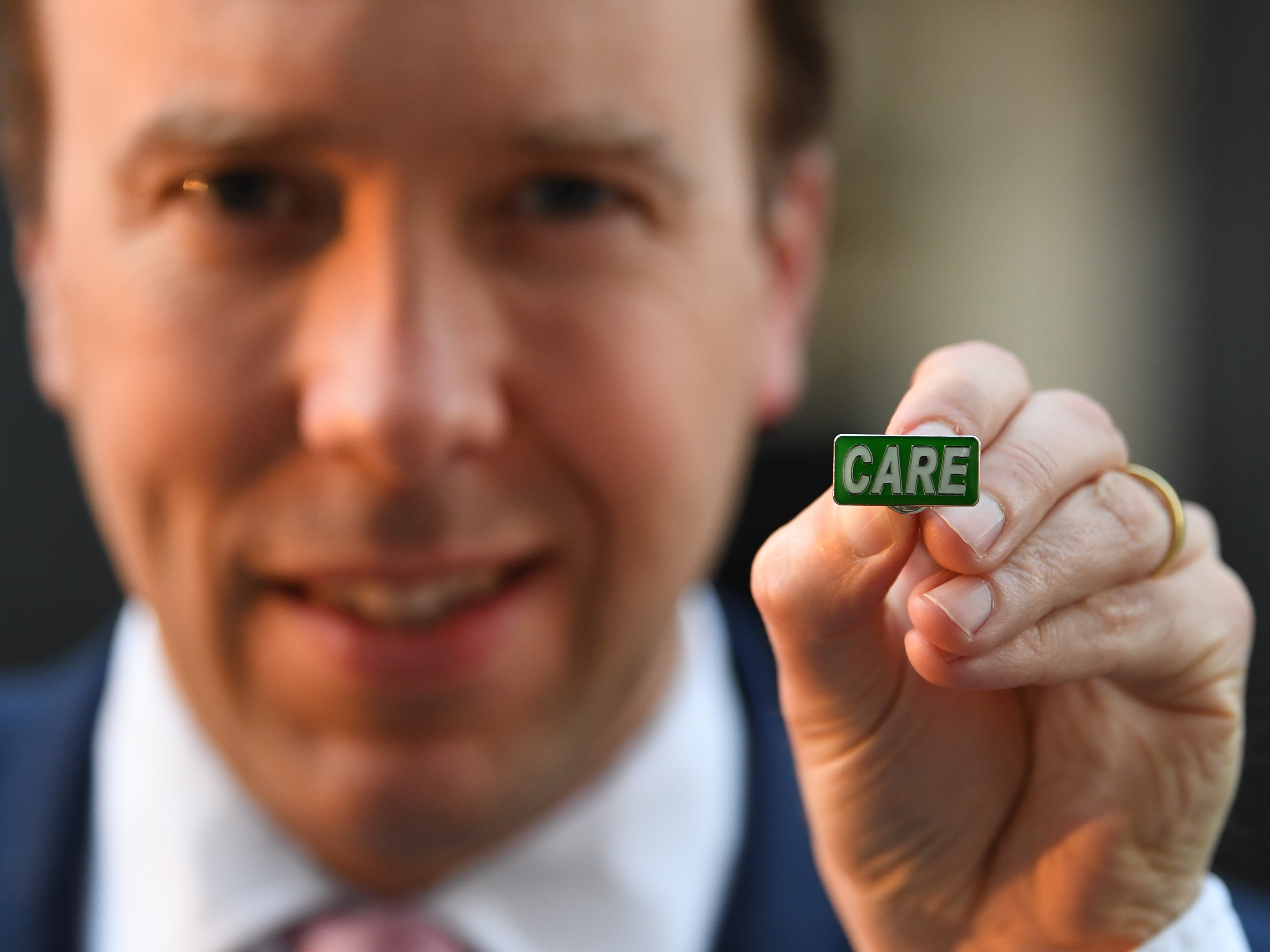 Matt Hancock displays an NHS-style ‘Care’ badge in April 2020. Ministers have still not delivered the reform plan Boris Johnson said was ‘prepared’ in 2019