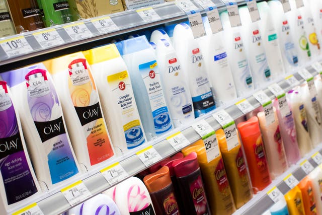 Olay and Dove lotion on display in a store