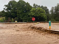 Hawaii orders evacuation after heavy rain breaches dam and threatens deadly flooding