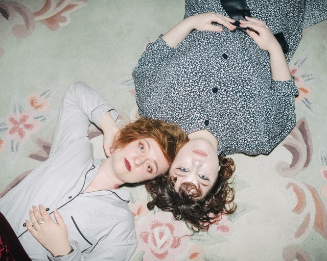 <p>Daria Serenko, left, and Sonia Sno in the room where they sleep and work at Femdacha</p>